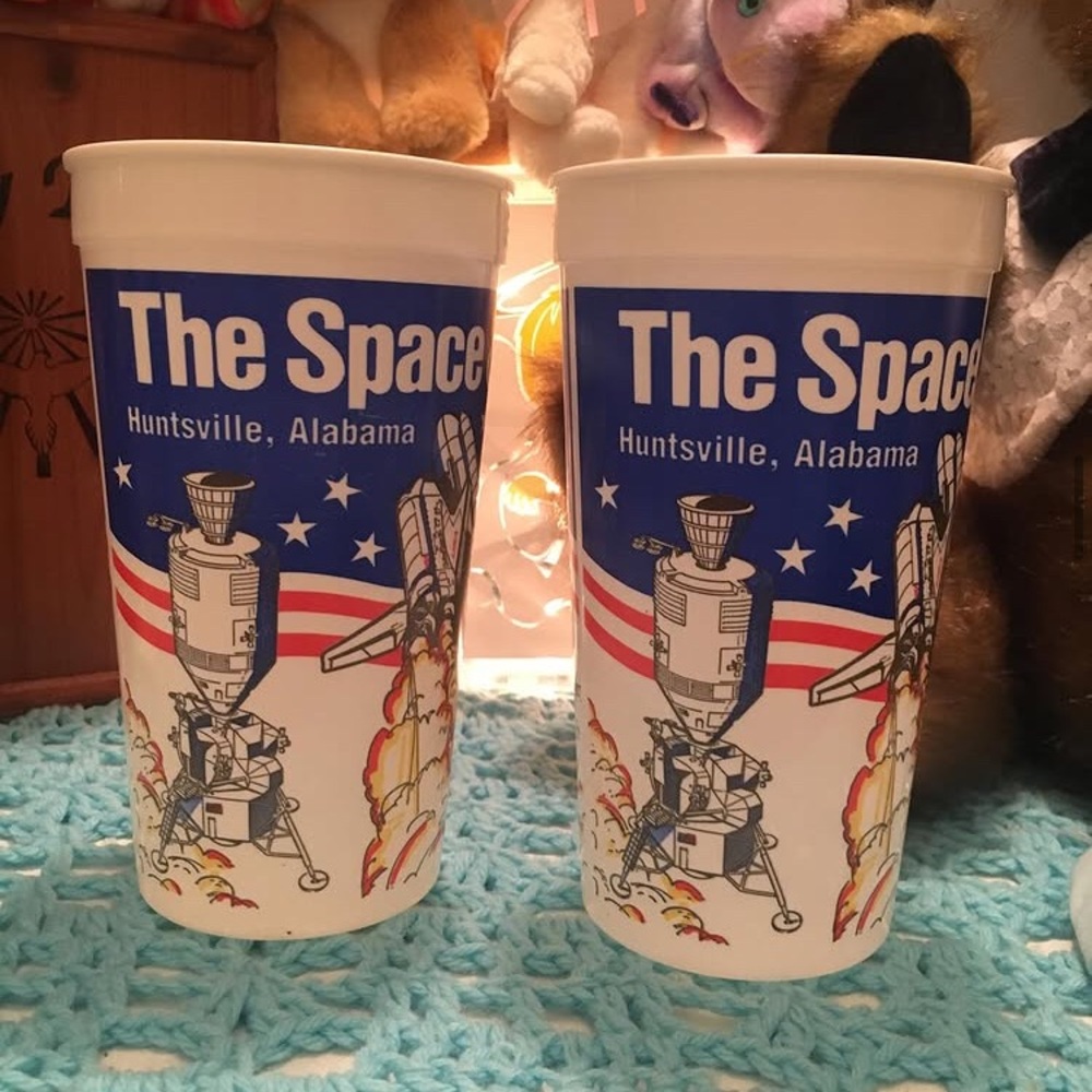 The S P A C E and R O C K E T centre plastic cups